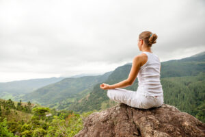 Woman,Is,Doing,Yoga,Exercises,In,Mountains